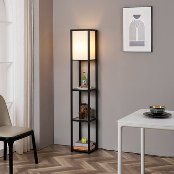 FENLO Fina floor lamp with shelves lit up in a living room corner